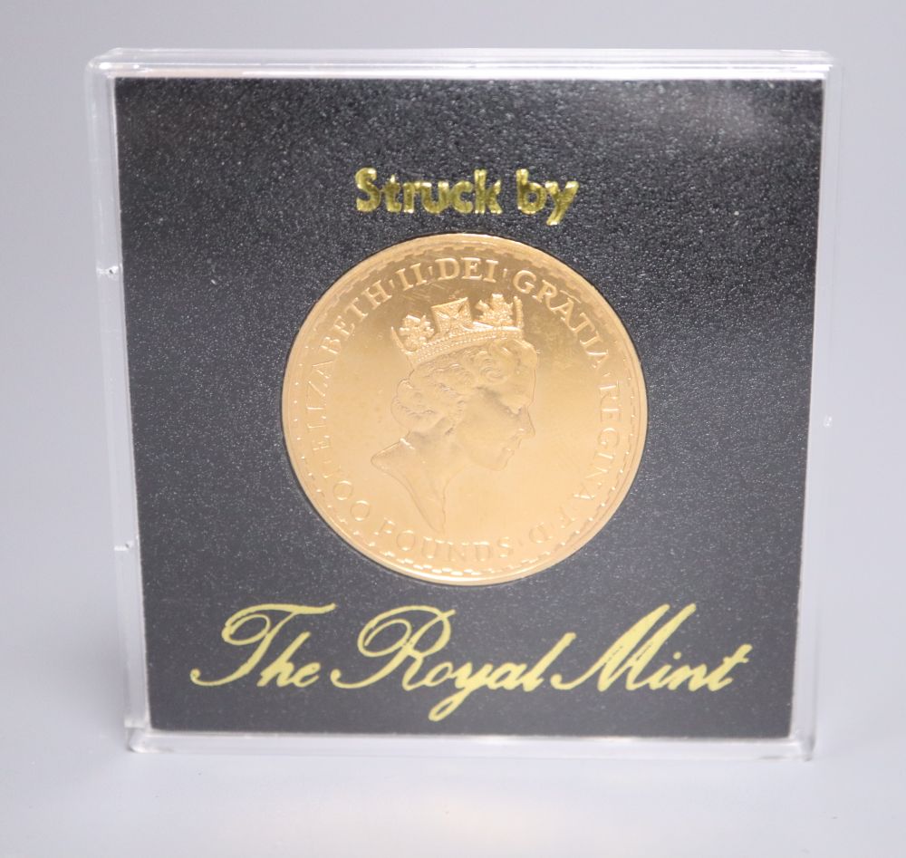 A Royal Mint QEII gold proof £100 one ounce coin.